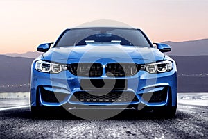 Blue bmw m3 sportcar without logos in mountain road. Frontal view