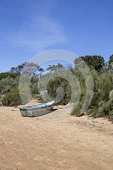 Blue boat on the beach near Cacela Velha, Algarve, Portugal