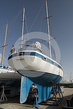 Blue boat on dock for maintaines