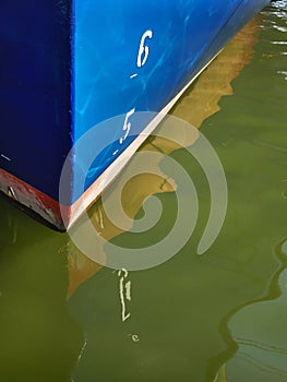 Blue Boat Hull and Reflection in Water