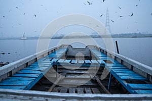 A blue boat lying in yamuna ghat delhi