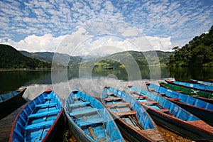 Blue boats in Lake Pokhara nepal photo
