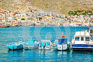 Blue boats moored side-by-side in peaceful port