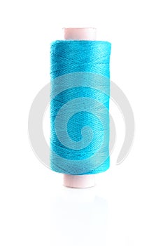 Blue bobbin thread isolated
