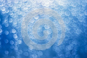 Blue bokeh background with blur white circles