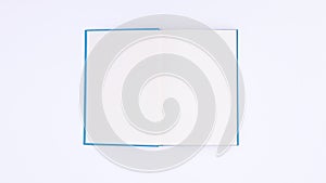 Blue book appear open and close on white background. Stop motion