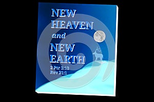 Blue Book with Text "NEW HEAVEN and NEW EARTH" photo