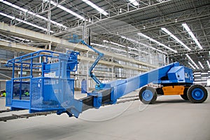 Blue boom lift perspective indoor photo