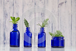 Blue bottles of aromatic essential