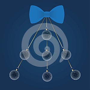 Blue bow with hanging Christmas balls arranged in shape of a Christmas tree