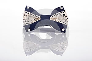 Blue bow tie with white lace