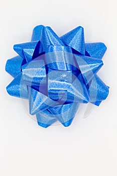 Blue bow on white background for birthdays, family celebrations, gifts or other celebrations as decoration