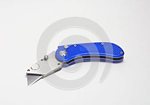 Blue box cutter or utility knife with blade open