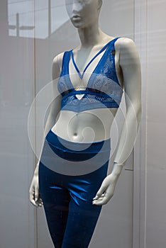 blue bra and blue leggins on mannequin in a fashion store for women showroom