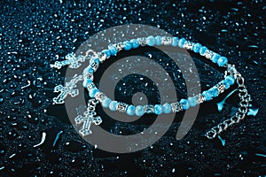 Blue bracelet with drops of water