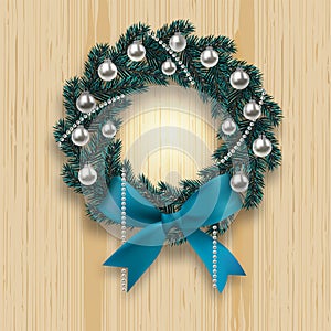 Blue branch ate in the shape of a Christmas wreath with shadow. Blue onions, silver balls and beads on a background of