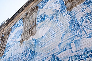 Blue brick tiled painting on a church wall landmark in Porto