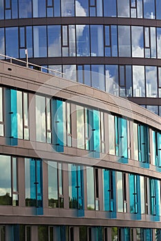 Blue brise soleil sun breakers on modern office glass building