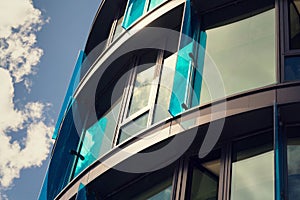 Blue brise soleil sun breakers on modern office glass building