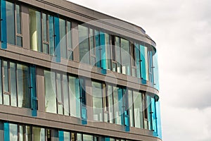 Blue brise soleil sun breakers on modern office glass building