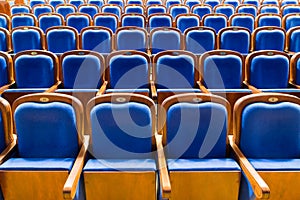 Blue brown wooden chairs in the auditorium. Without people