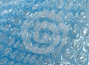 Blue bubble wrap close up in diagonal direction, full frame