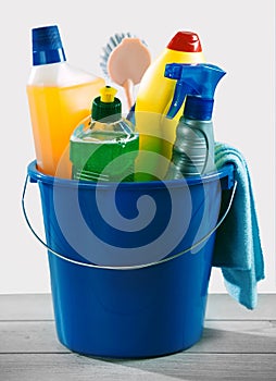 Blue bucket of detergent and chemical cleaner