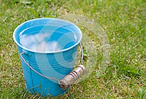 Blue bucket of water