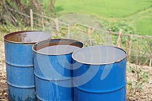 Blue buckets contain water in garden. Concept, Solve problems lacking of water in agriculture