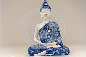 Blue buddha image on white background