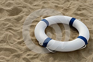 blue buoy on sand with copy space