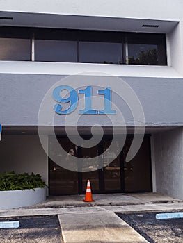 Blue Business Building with a Large 911 Blue Numbers on The Front