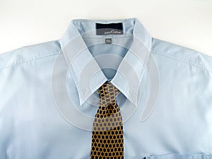 blue business shirt with size and type label on inside collar and black necktie with yellow striped isolated on white background