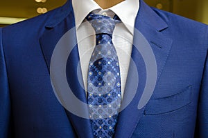 Blue business suit with a white shirt and with a blue tie in drawing