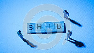 Blue businessman at SHIB words