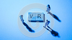 Blue businessman at VR words