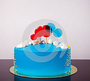 Blue buttercream Birthday cake with colorful lollipops