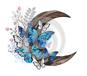 Blue butterflies on wooden crescent