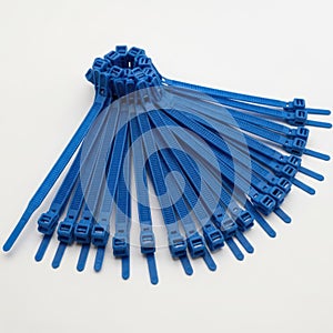 Blue cable ties bundle isolated on white background