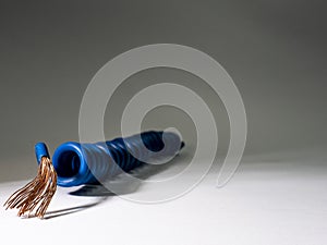 Blue cable twisted on grey background.electrical insulated wire