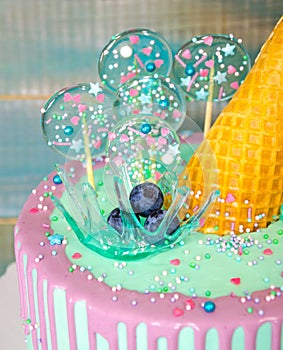 Blue cake with ice cream cone and caramel decoration