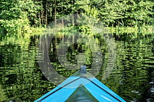 Blue canoe on the river