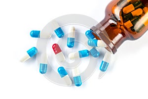 Blue capsules and red capsules with bottle, healthcare and medi