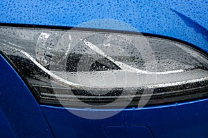 Blue car detail, car headlight, vehicle lighting source