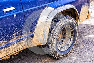 Blue car dirty with mud