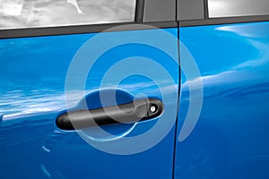 Blue car door handle