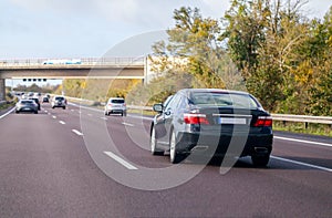 Blue car drives on a german motorway
