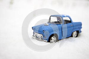 Blue car in snow