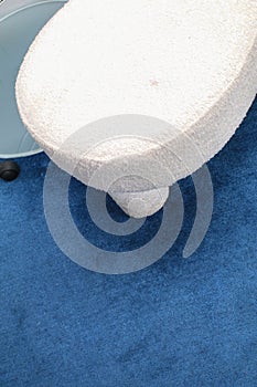 Blue carpet with white fabric chair texture for background for interior design.