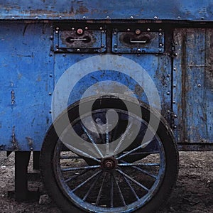 Blue cart by the roadside.